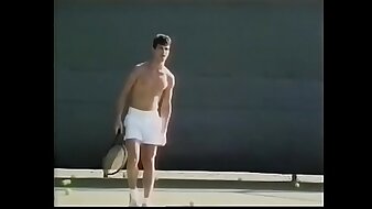 Tennis player likes to loosen his penis stiff muscles after excercises with ball shooter machine and drop his load on his tennis racket